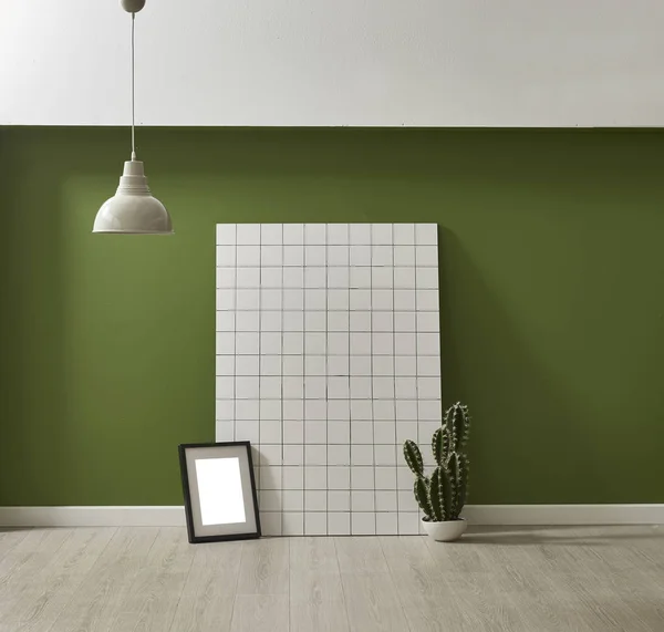 modern green wallpaper and mock up interior decoration with cactus and frame