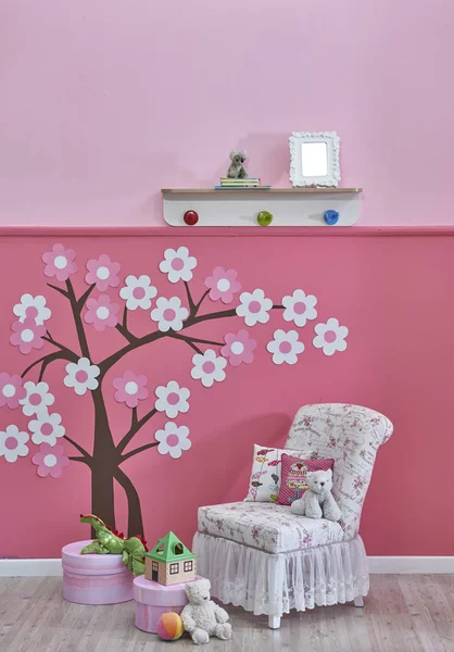 new children\'s room with toys, pink wall and tree pattern ,Decorative interior design