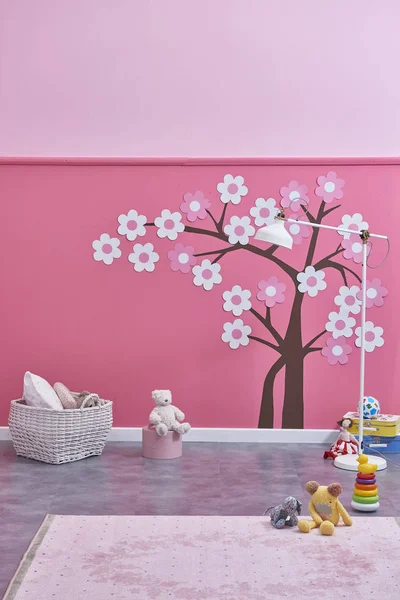 new children\'s room  and toys , pink wall and tree pattern ,Decorative interior design
