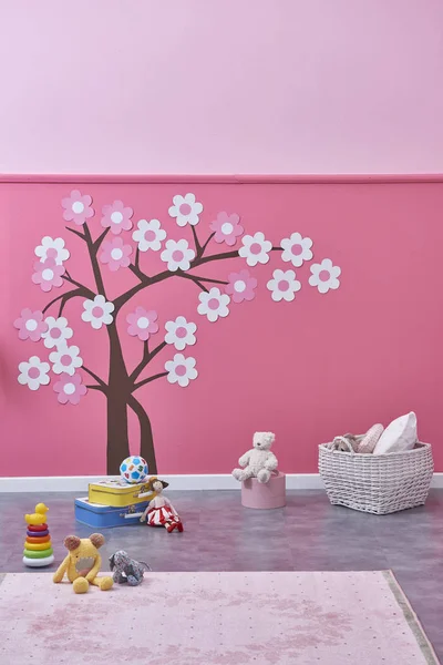 new children\'s room  and toys , pink wall and tree pattern ,Decorative interior design