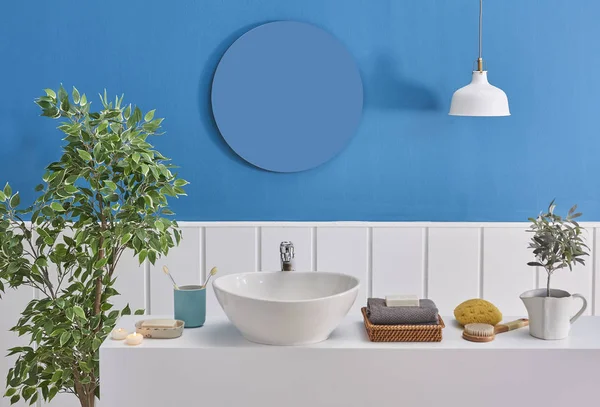 Close up bath and sink style, blue and white wall, mirror and spa decor