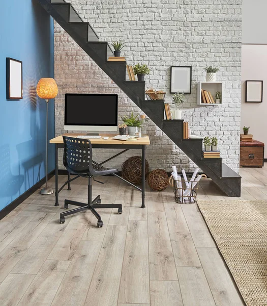 Modern living room, white brick wall, wooden desk and desktop , black stair, carpet sofa in  interior.