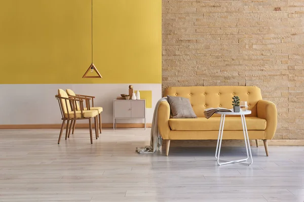 yellow and white wall home living room concept. orange sofa with lamp decoration. Modern yellow wall background