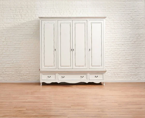 White classic wardrobe in the room and brick wall background style.