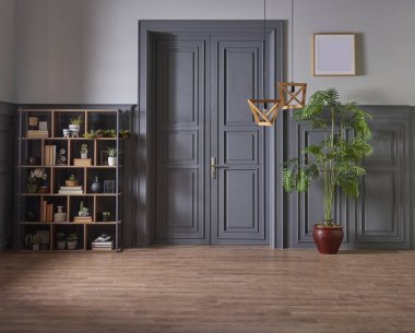 Klasik gri duvar ve kapı tarzında dekoratif ahşap kitaplık, yeşil bitkinin lamba çerçevesi ve vazosu.