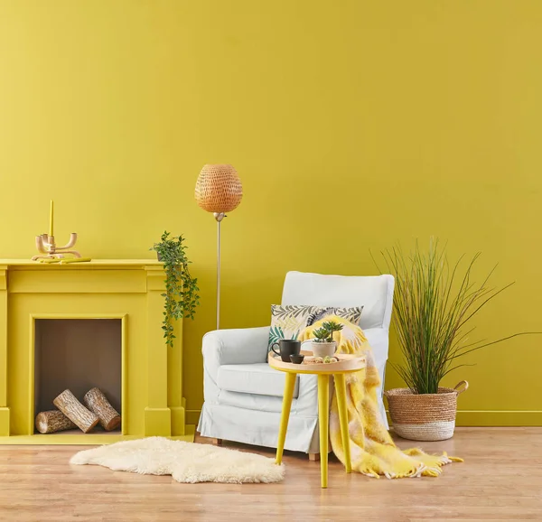 Yellow wall room, fireplace and armchair, green interior plant, orange lamp and clock style.