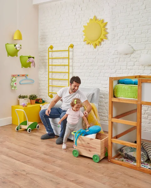 Modern baby room corner decor, dad is spend good time with his baby.