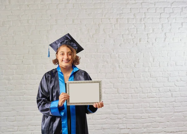 Graduated girl and graduation clothing in front of the white brick wall, certificate and ruler background style.