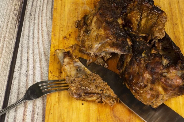 Pork ribs baked with spices on wooden cutting Board — Stock Photo, Image
