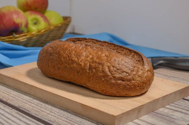 Fresh craft bread on a wooden chopping Board.