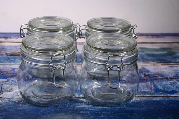 Glass jar with lid and metal lock for storing spices. — Stock Photo, Image