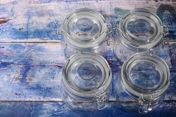 Glass jar with lid and metal lock for storing spices. — Stock Photo, Image