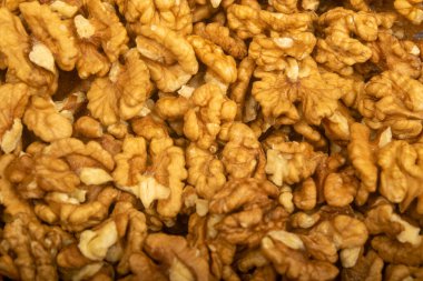 Soyulmuş ceviz gevşek yüzey dokusu. Sağlıklı beslenme. Fitness diyeti. Kapat.