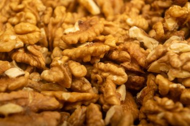 Soyulmuş ceviz gevşek yüzey dokusu. Sağlıklı beslenme. Fitness diyeti. Kapat.