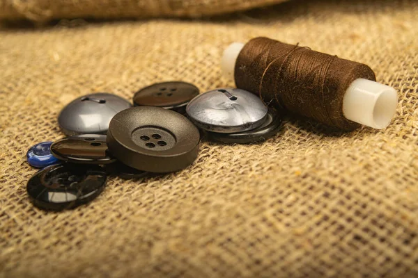 Different Buttons Spool Thread Burlap Rough Texture Close — Stock Photo, Image