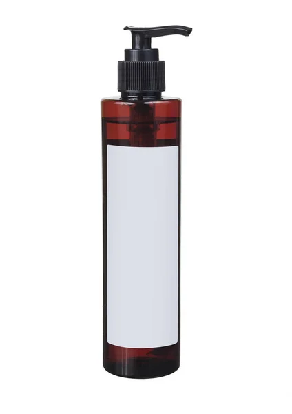 Bomba cabeça garrafa de plástico marrom com líquido transparente e etiqueta em branco — Fotografia de Stock