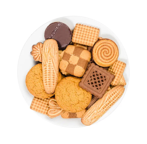 Variety of sweet cookies on a plate on white background, top view — Stock Photo, Image