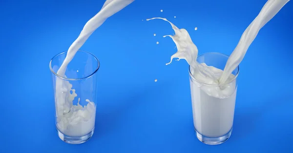 Two Glasses Pouring Milk One Full Splash One Less Full — Stock Photo, Image