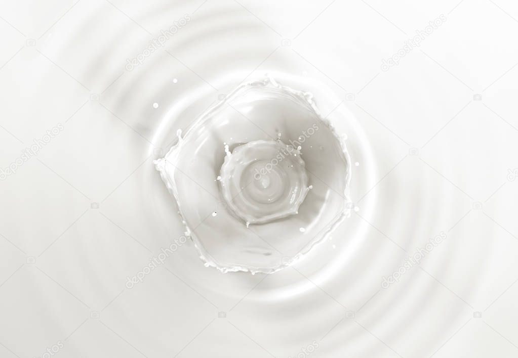 Milk double crown splash, splashing in milk pool with ripples. Viewed from the top.