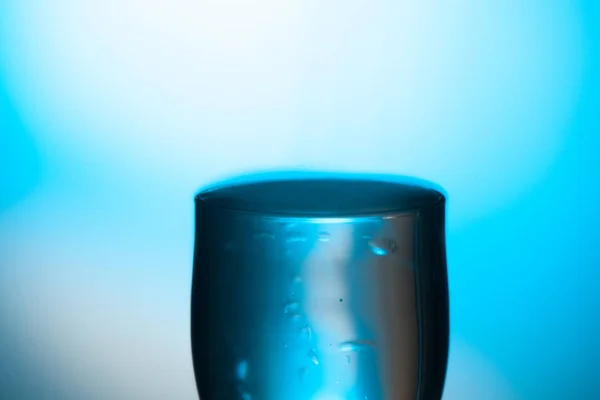 drinking glass of water or glass of water with undefined poison