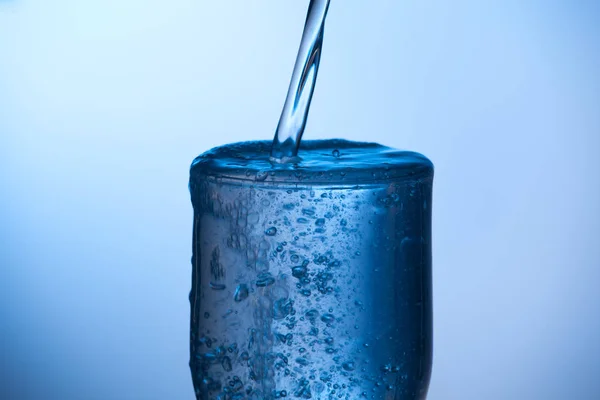 drinking glass of water or glass of water with undefined poison