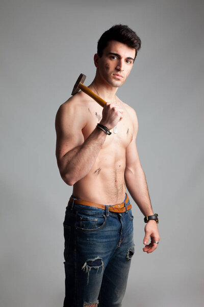 Young sportsman, probably professional mechanic or construction professional.