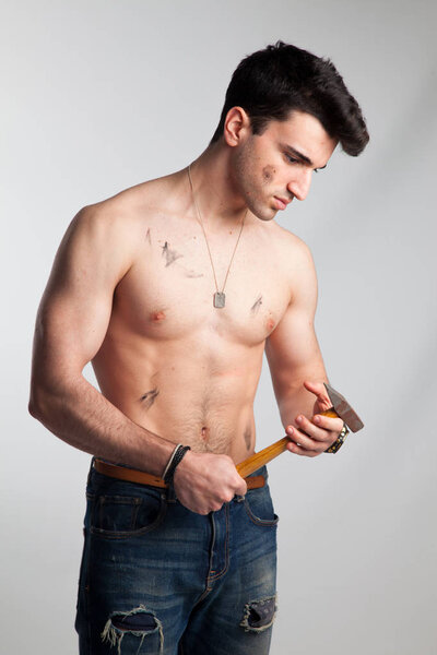 Young sportsman, probably professional mechanic or construction professional.