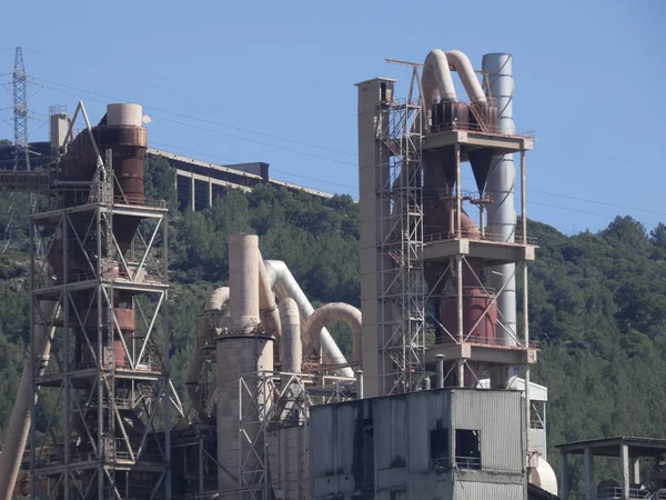 Cement factory in the middle of a mountain with cement ore quarries