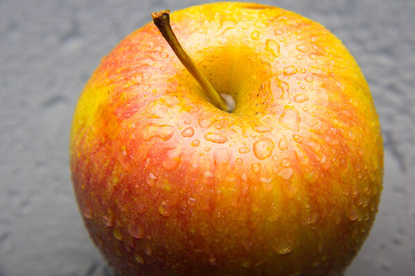 Apple full of drops of water, ideal to eat it for dessert, rich healthy and full of vitamins