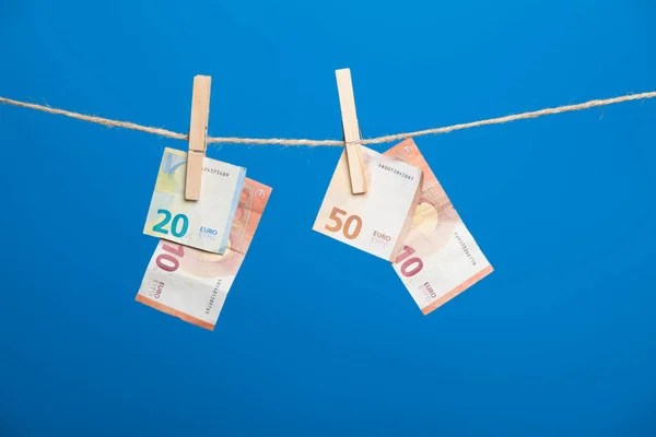 Euro banknotes, money of the European economic community. The money is the fruit of work, of the benefits of the investment, the losses or profits of the company, the profits of the bank. Money is necessary for life in today\'s society.
