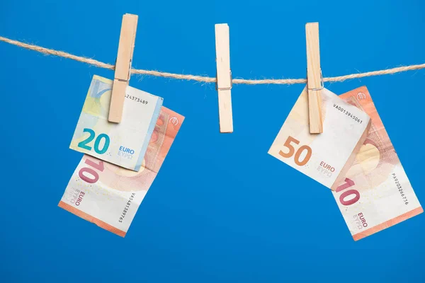 Euro banknotes, money of the European economic community. The money is the fruit of work, of the benefits of the investment, the losses or profits of the company, the profits of the bank. Money is necessary for life in today\'s society.