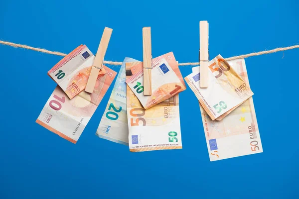 Euro banknotes, money of the European economic community. The money is the fruit of work, of the benefits of the investment, the losses or profits of the company, the profits of the bank. Money is necessary for life in today\'s society.