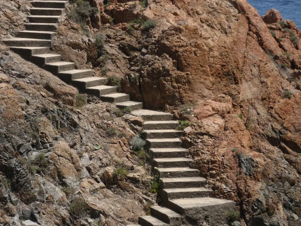 Stairs that give access to a small cove on the Costa Brava;