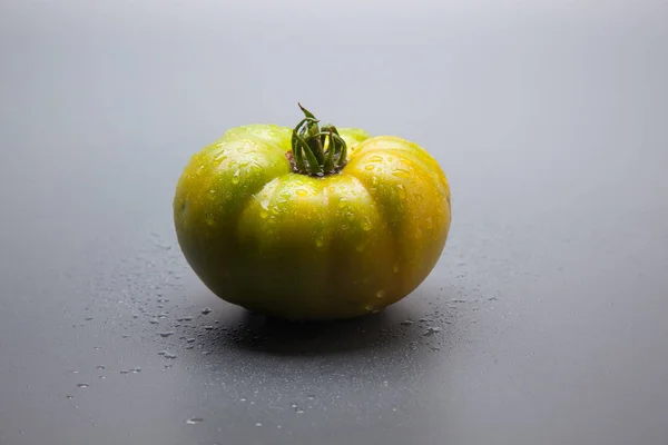 Green tomatoes, freshly brought from the garden to be taken to the final consumer or to the market to be sold. Green tomatoes that will ripen little by little in the refrigerators and arrive at the market in perfect color to be eaten. Raw