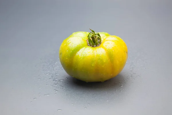 Green tomatoes, freshly brought from the garden to be taken to the final consumer or to the market to be sold. Green tomatoes that will ripen little by little in the refrigerators and arrive at the market in perfect color to be eaten. Raw