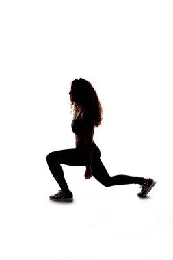 Egzersiz ve jimnastik tahtaları yapan bir kız, kişisel antrenör, beyaz arka planda siyah siluet, iyi eğitimli, mükemmel vücut