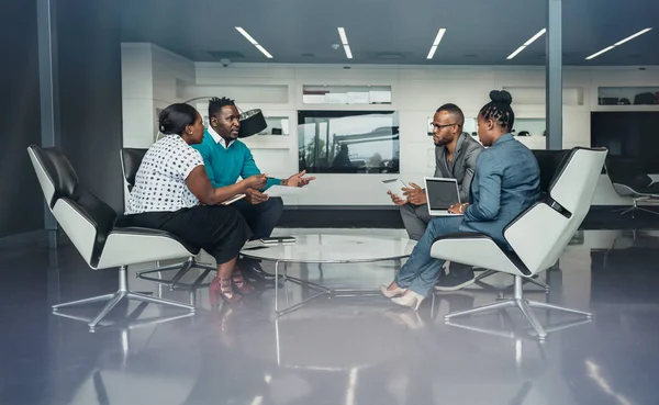 Team of african business people sitting in a meeting