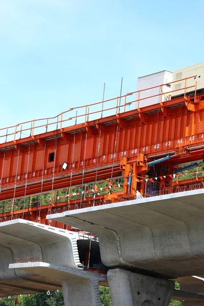 Construction site of car bridge, express way with red container and site over the flyover at outdoor