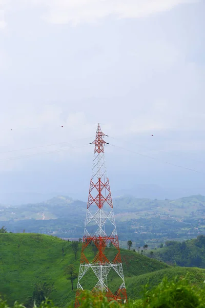 Red and white electricity line pole for energy and communication