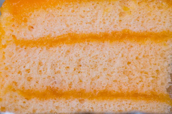 オレンジケーキの層を閉じます マクロオレンジ甘酸っぱいデザートの食感 — ストック写真