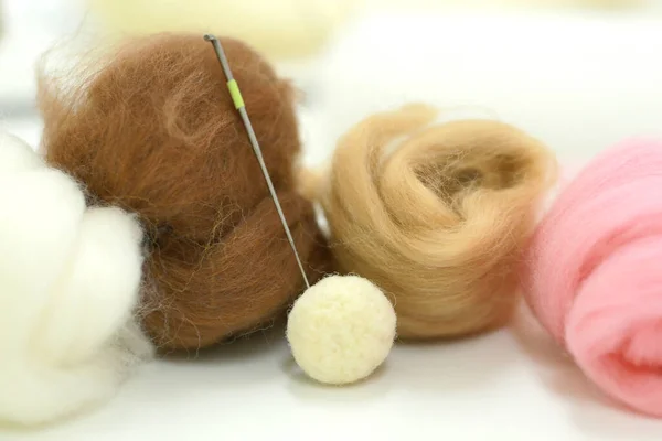 Needle felt, wool weaving handmade craft by sheep hair. Sheep hair wool made by needle press to be doll.