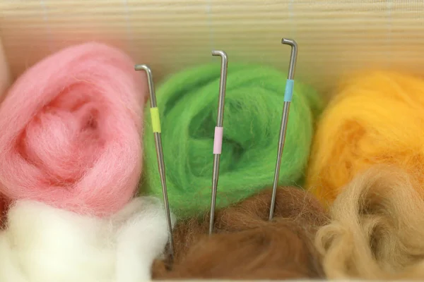 Needle felt, wool weaving handmade craft by sheep hair. Sheep hair wool made by needle press to be doll.