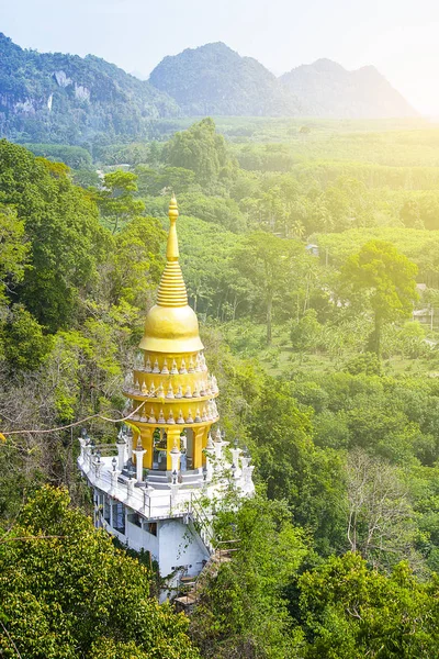 Golden Pagoda on the top of the hill At Surat Thani, Thailand.