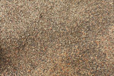 Çakıl taş zemin döşemesi sorunsuz arka planı. Çimento çakıl çakıl taş zemine doku karışık. Islak yuvarlak çakıl taş taş zemin dramatik ışık