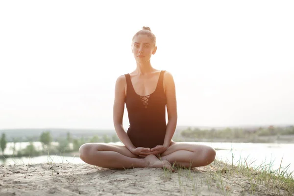 Beautiful Caucasian Girl Black Swimsuit Sitting Lotus Position Nature Backdrop — Stock Photo, Image