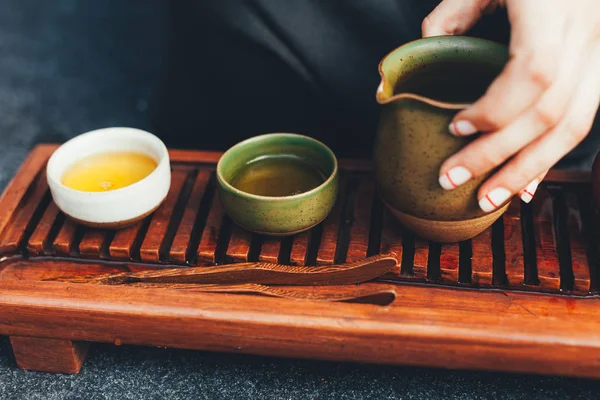 Traditional tea ceremony close up with woman hand — Stock Photo, Image