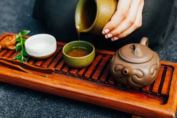 Traditional tea ceremony close up with woman hand — Stock Photo, Image