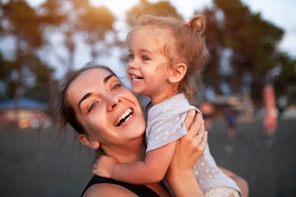 Happy mother and her little daughter outdoor. — Stock Photo, Image