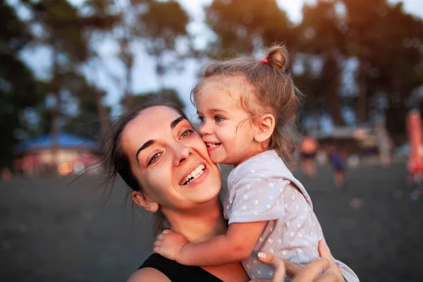 Happy mother and her little daughter outdoor. — Stock Photo, Image