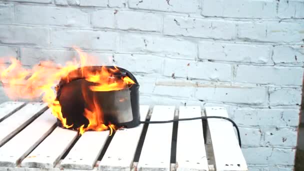 Burning toaster. Toaster with two slices of toast caught on fire over white background — Stock Video